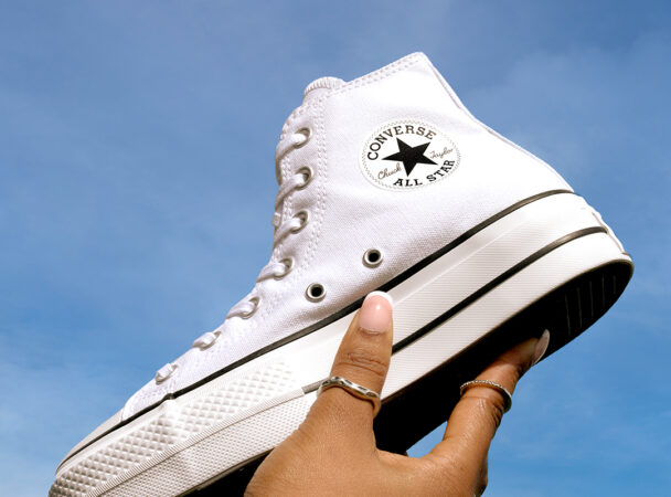 Converse All Star Hi in White Being Held in the Air