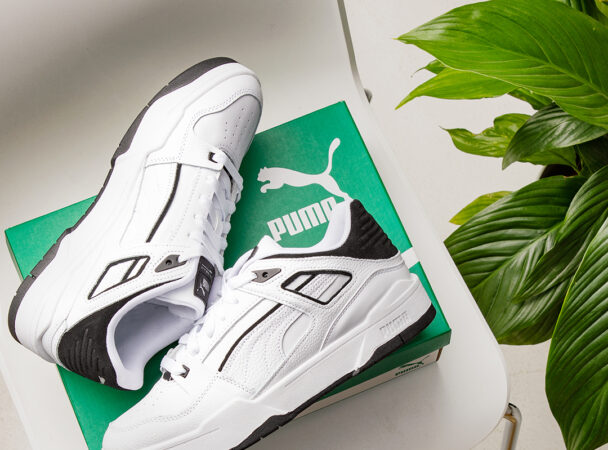 PUMA Trainers on top of shoe box